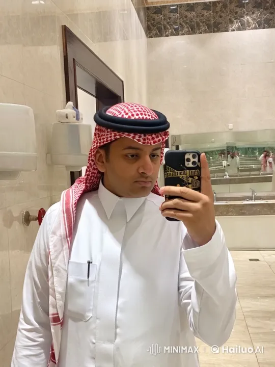 Man in Traditional Attire Takes Selfie, Smokes in Modern Restroom – AI Generated Video | Hailuo AI