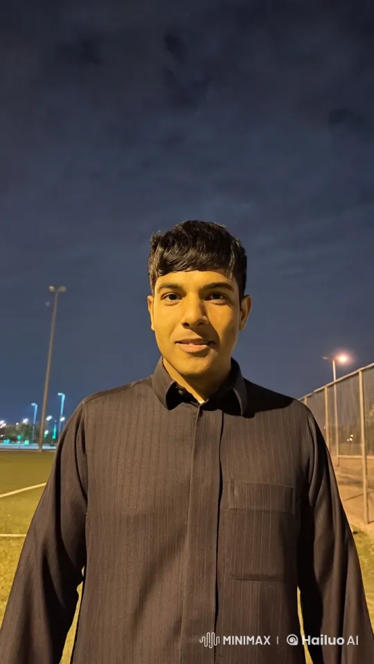 Man Smoking by Night at Illuminated Sports Field – AI Generated Video | Hailuo AI