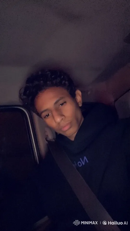 Quiet Night: Person Smoking in Dimly Lit Parked Car – AI Generated Video | Hailuo AI
