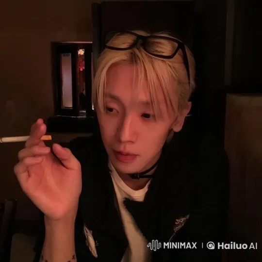 Contemplative Smoking Scene in a Dimly Lit Room – AI Generated Video | Hailuo AI