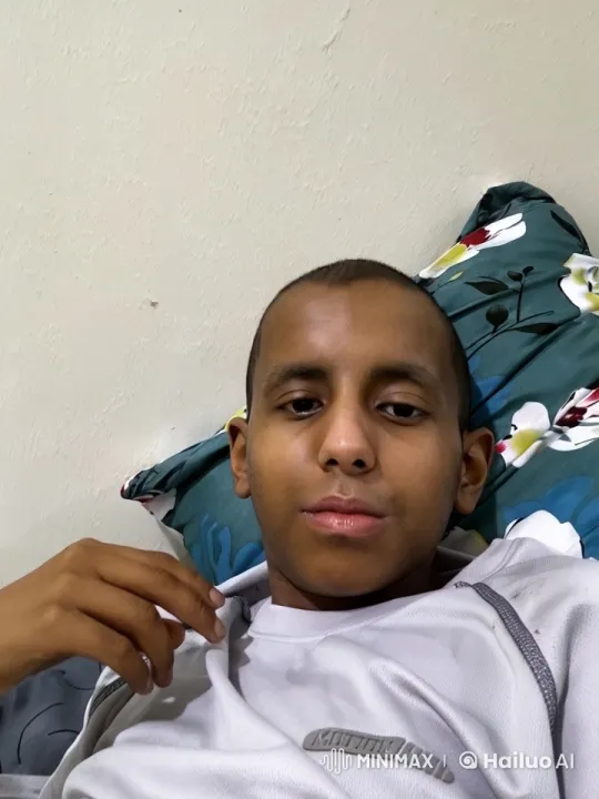 Relaxed Person Smoking on Bed with Floral Pillow – AI Generated Video | Hailuo AI