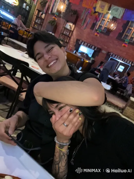Affectionate Moment in a Vibrant Restaurant Setting – AI Generated Video | Hailuo AI