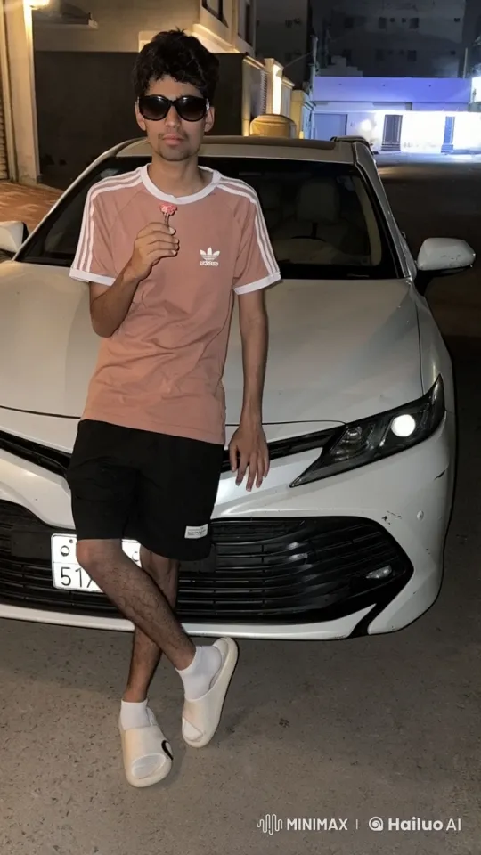 Young Man Smoking by Car in Urban Night – AI Generated Video | Hailuo AI