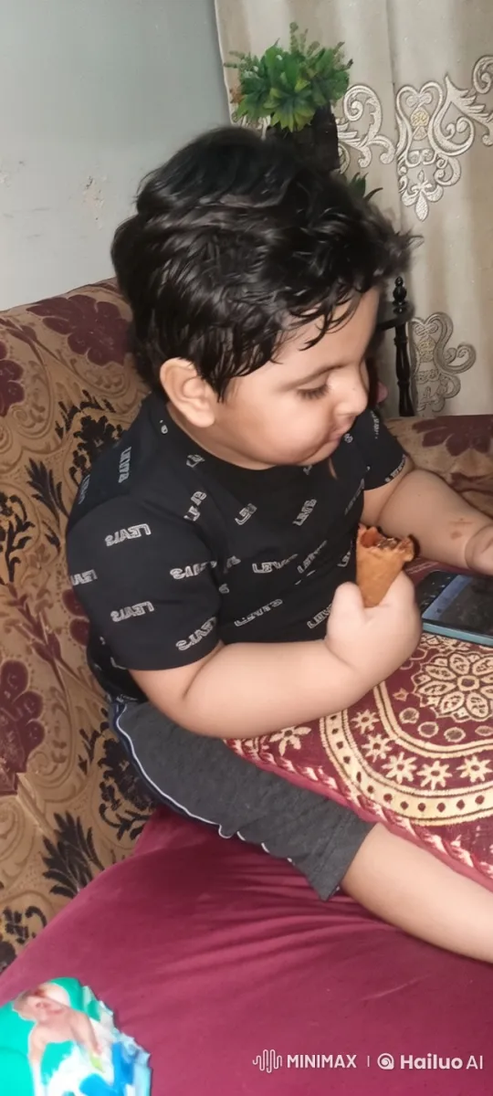 Child Enjoying Ice Cream and Dancing on Sofa – AI Generated Video | Hailuo AI