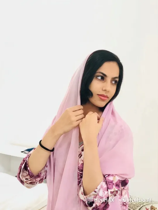 Woman in Light Pink Attire Smokes Deliberately – AI Generated Video | Hailuo AI