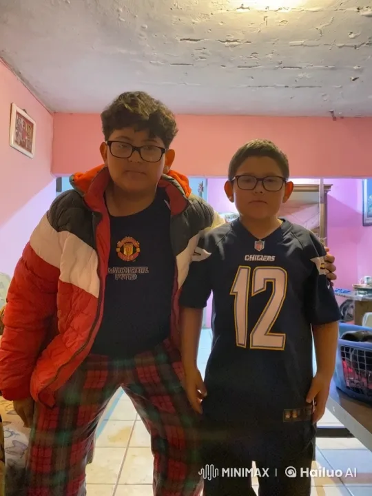 Boys Share Affectionate Moment in Cozy Living Room – AI Generated Video | Hailuo AI