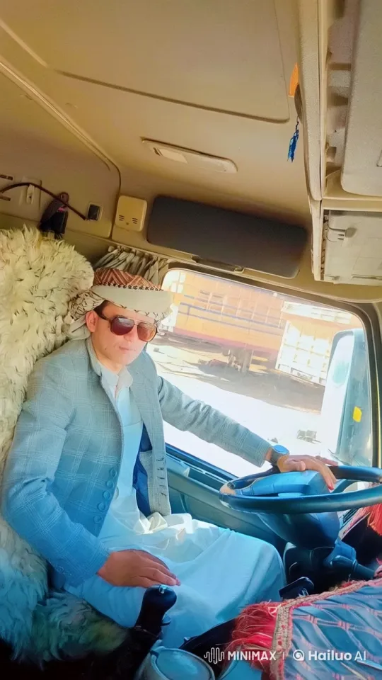 Traditional Attired Man Smokes in Truck Cab – AI Generated Video | Hailuo AI