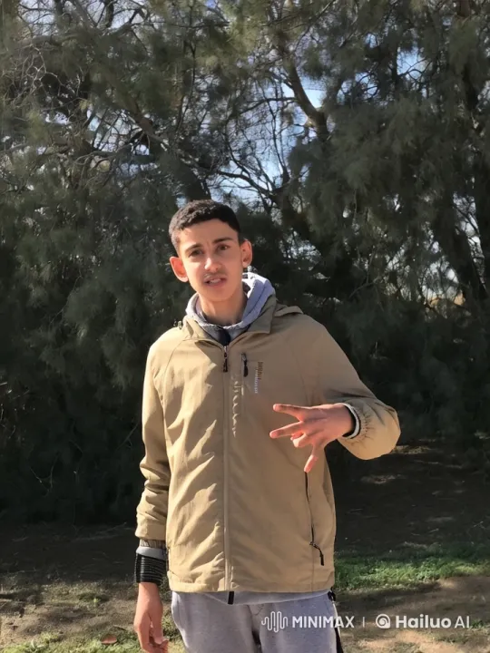 Young Man Smoking Casually Outside Amidst Swaying Trees – AI Generated Video | Hailuo AI