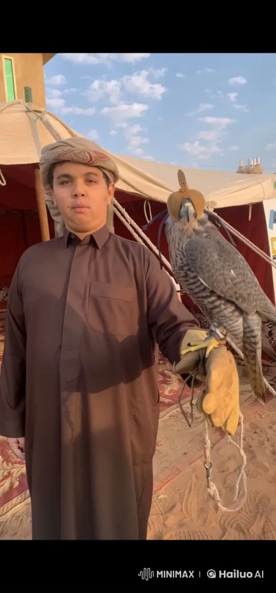 Traditional Man Smokes Calmly Beside Falcon-Perched Tent – AI Generated Video | Hailuo AI