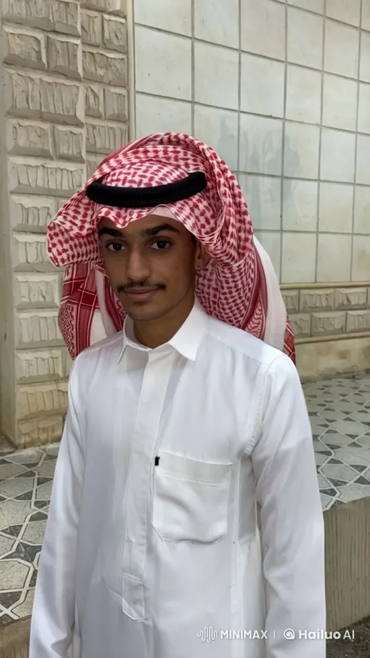 Man Smoking in Traditional Attire Against Tiled Wall – AI Generated Video | Hailuo AI