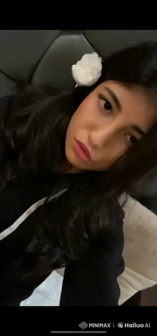 Woman Smoking with White Flower Clip in Dark Setting – AI Generated Video | Hailuo AI