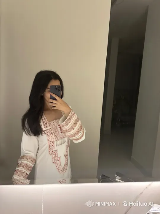 Person Smokes in Mirror with Embroidered Outfit – AI Generated Video | Hailuo AI