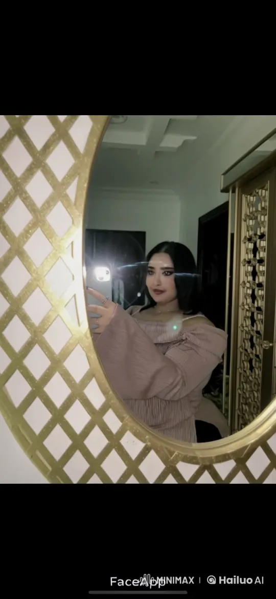 Woman in Pale Pink Top Takes Selfie and Smokes in Elegant Setting – AI Generated Video | Hailuo AI