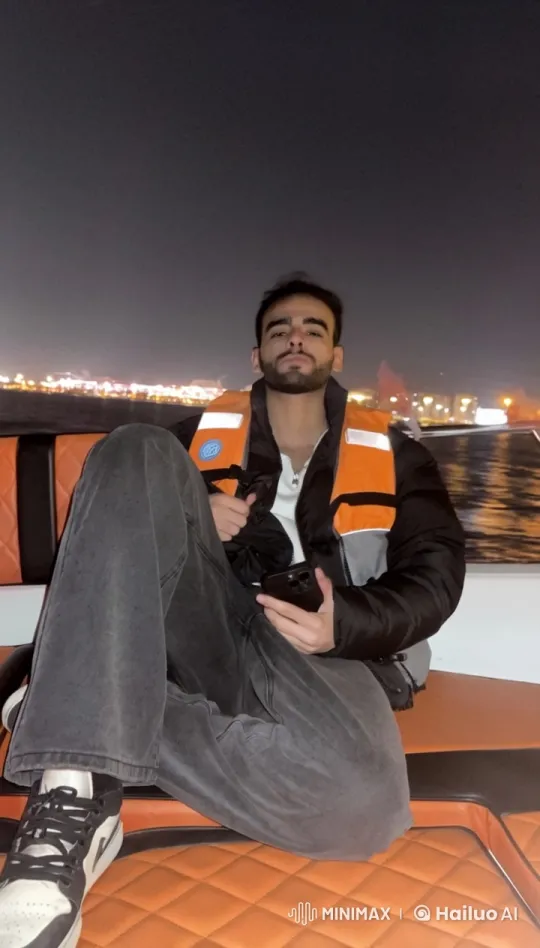 Young Man Smoking on Boat at Night with Cityscape Background – AI Generated Video | Hailuo AI