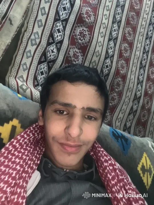 Relaxed Person Smoking Amidst Patterned Cushions and Tapestry – AI Generated Video | Hailuo AI
