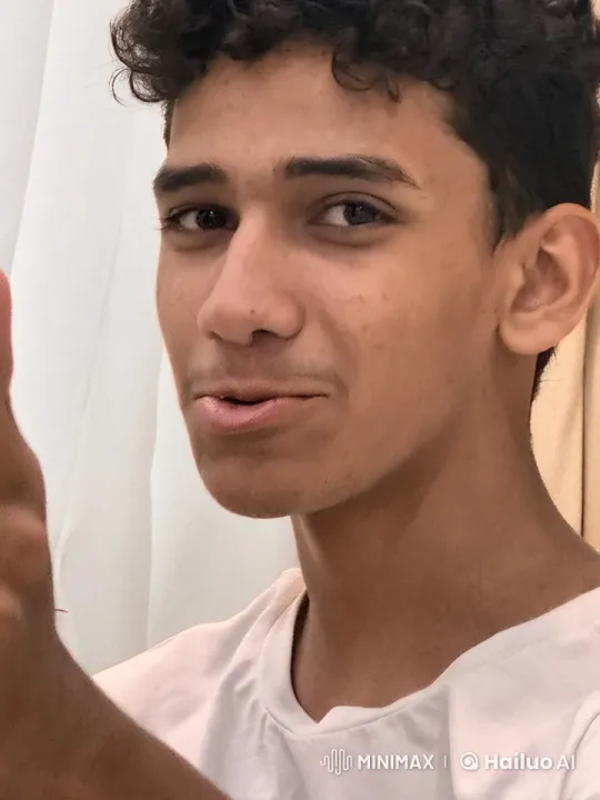 Young Man Contemplates with Cigarette in Indoor Setting – AI Generated Video | Hailuo AI