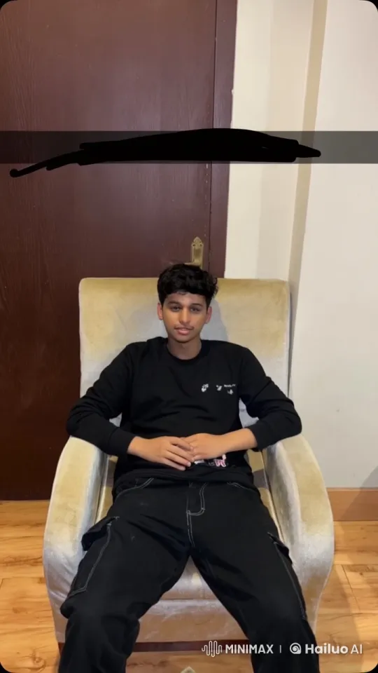 Young Man Contemplatively Smokes in Armchair – AI Generated Video | Hailuo AI