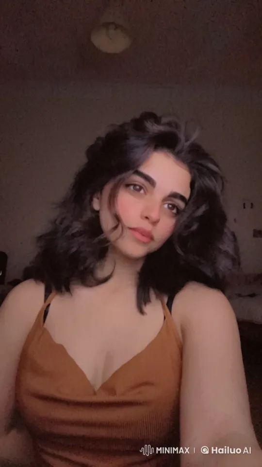 Intimate Scene: Woman Smoking in Dimly Lit Room – AI Generated Video | Hailuo AI