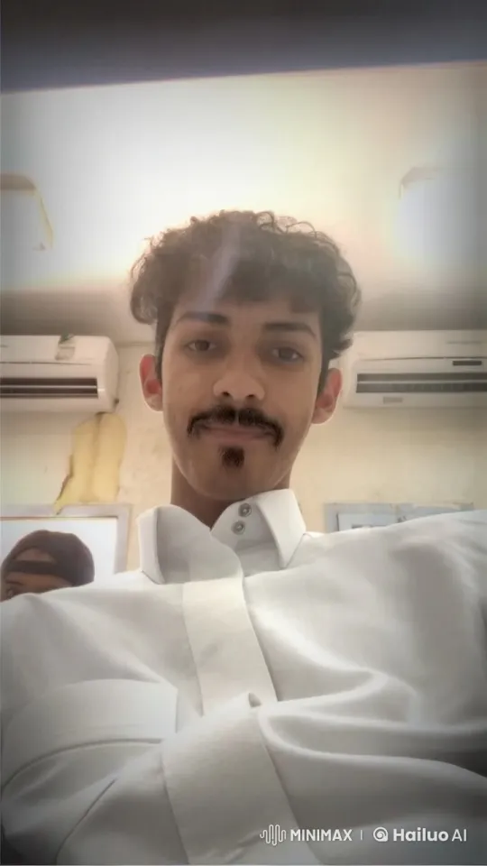 Young Man Smoking Calmly in Dim Room – AI Generated Video | Hailuo AI