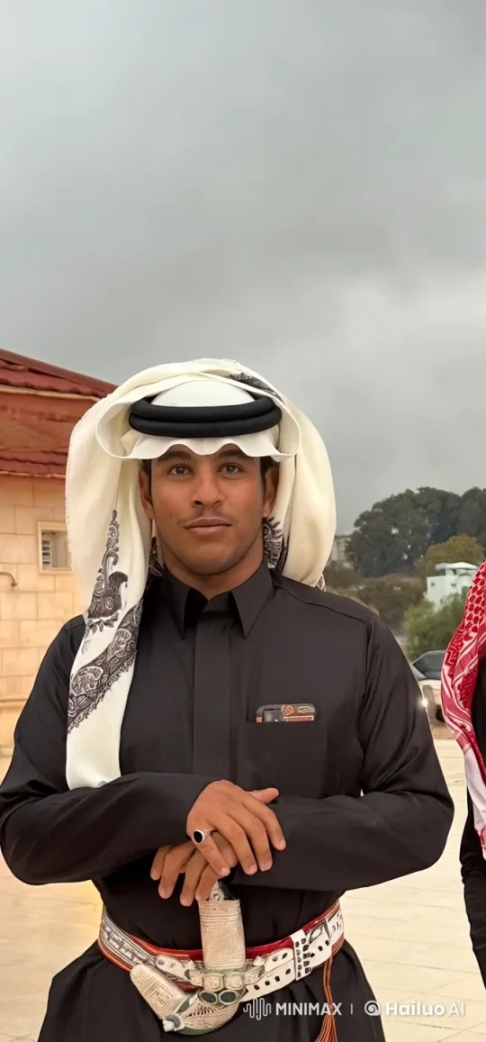 Traditional Attired Man Smoking Outdoors – AI Generated Video | Hailuo AI