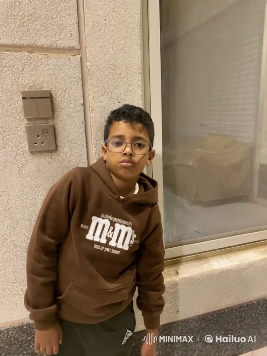 Young Boy Smoking in Relaxed Pose by Window – AI Generated Video | Hailuo AI