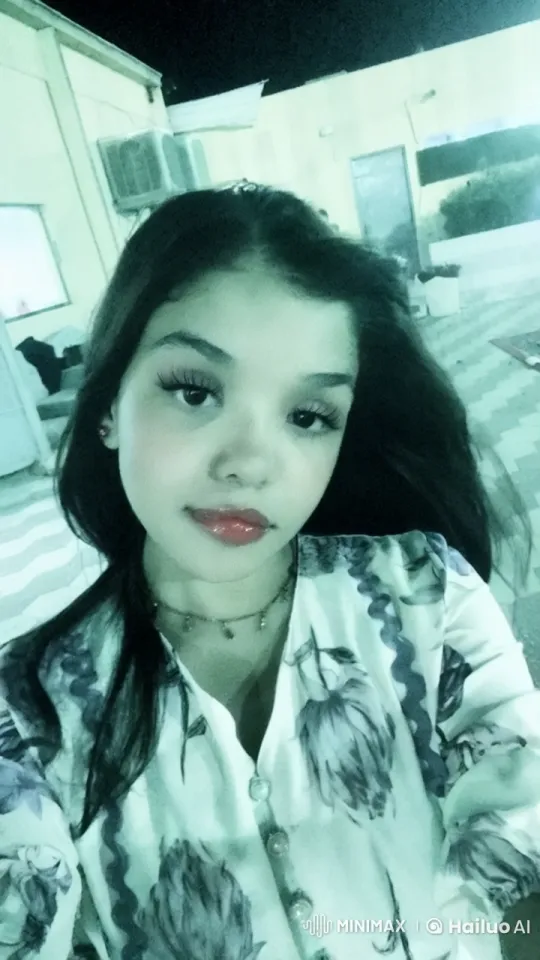 Nighttime Portrait of Woman in Floral Top – AI Generated Video | Hailuo AI