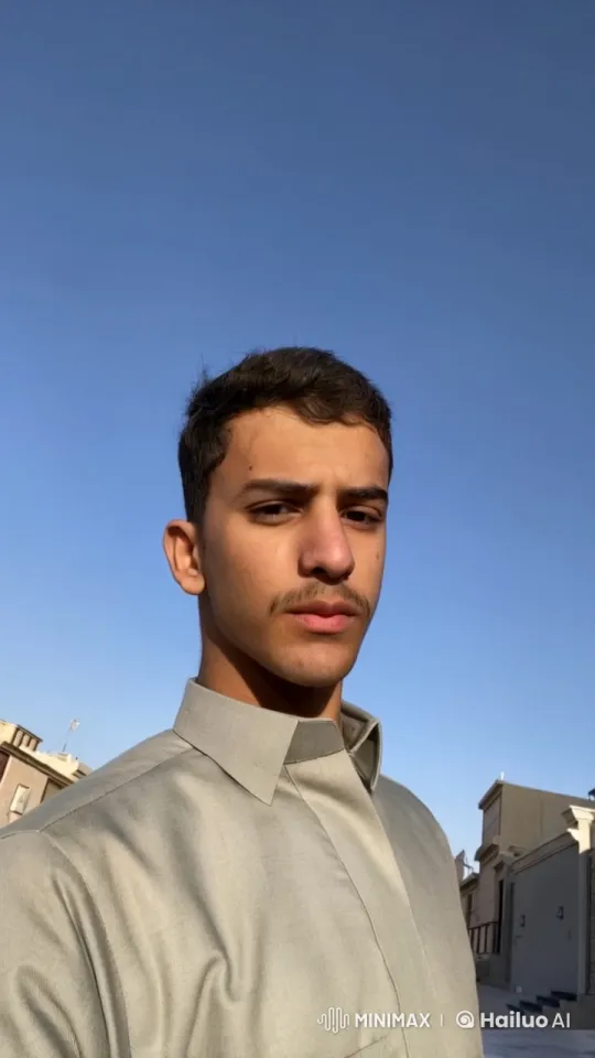 Young Man Smoking Outdoors with Contemplative Mood – AI Generated Video | Hailuo AI
