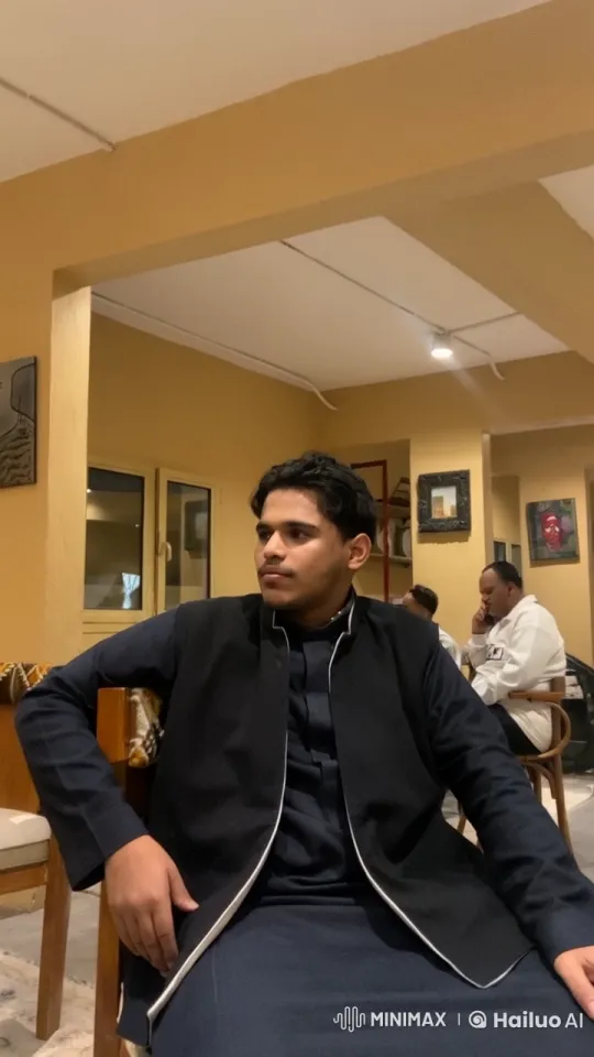 Young Man Relaxing in Cozy Room with Cigarette – AI Generated Video | Hailuo AI