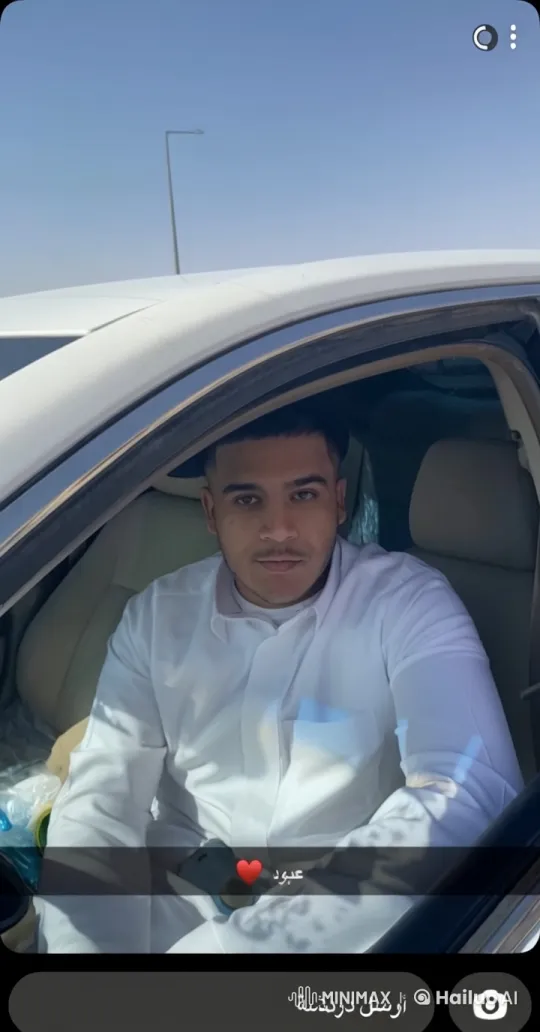 Man Smoking in White Car with Blue Sky Background – AI Generated Video | Hailuo AI