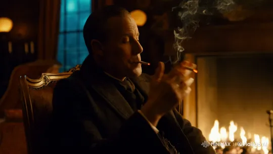 Contemplative Man in Vintage Armchair by Fireplace – AI Generated Video | Hailuo AI
