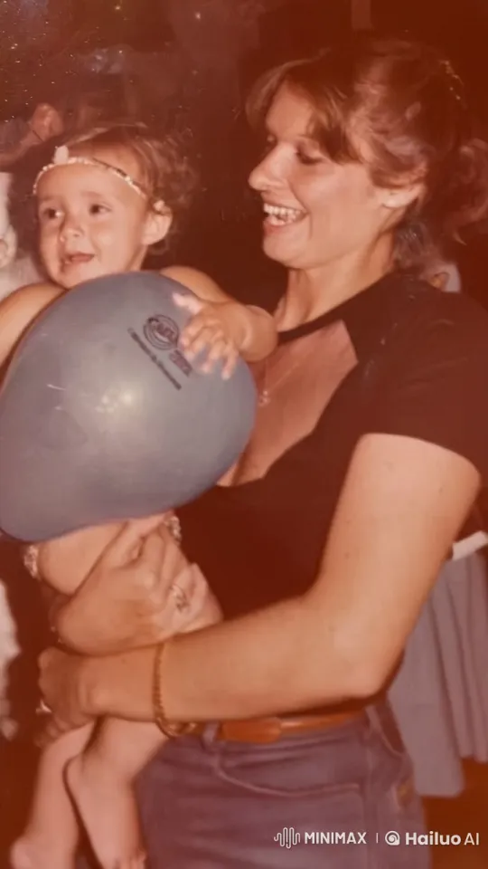 Woman Comfortably Holds Child with Balloon at Party – AI Generated Video | Hailuo AI