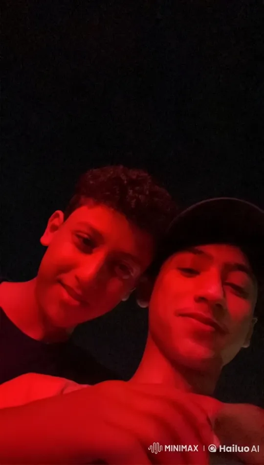 Two Individuals Smoking Under Red Light at Night – AI Generated Video | Hailuo AI