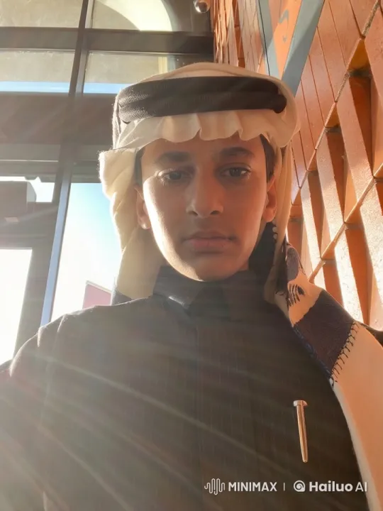 Man in Traditional Attire Smokes in Sunlit Building Entrance – AI Generated Video | Hailuo AI