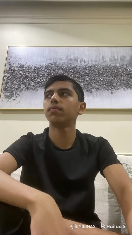 Young Man Relaxing on Couch in Contemporary Setting – AI Generated Video | Hailuo AI