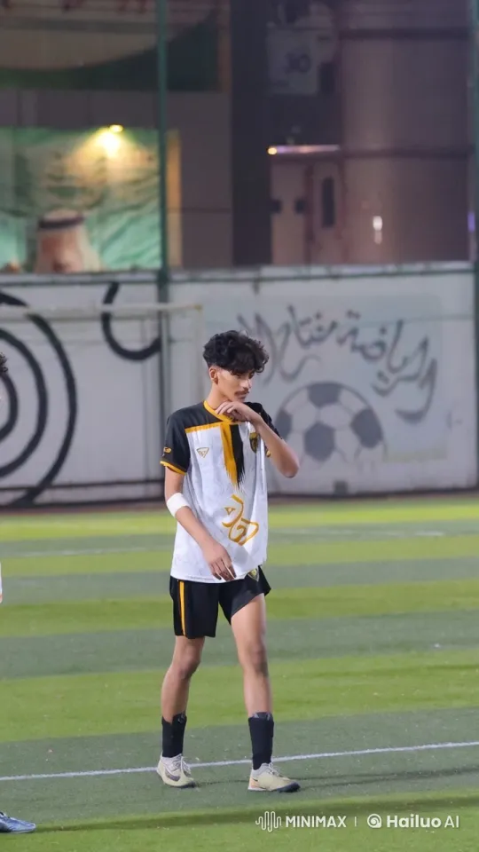 Young Soccer Player on Lit Field with Graffiti Background – AI Generated Video | Hailuo AI