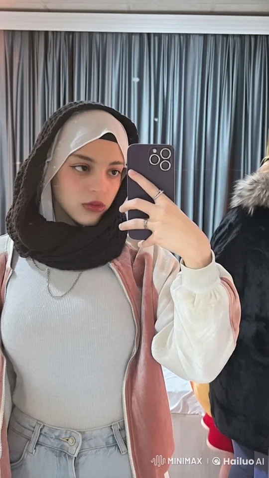 Person Taking Selfie in Mirror with Smoking Effect – AI Generated Video | Hailuo AI