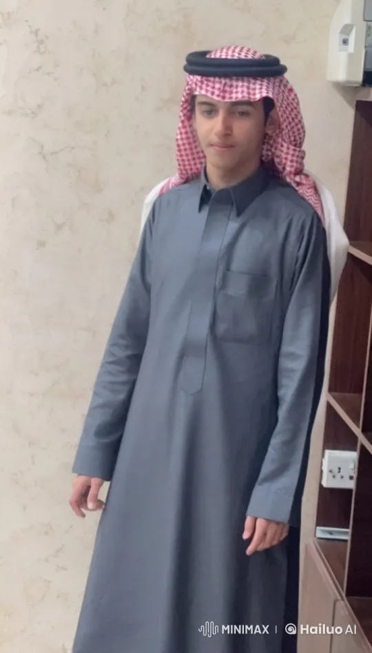 Man in Thawb Smokes by Wooden Cabinet – AI Generated Video | Hailuo AI