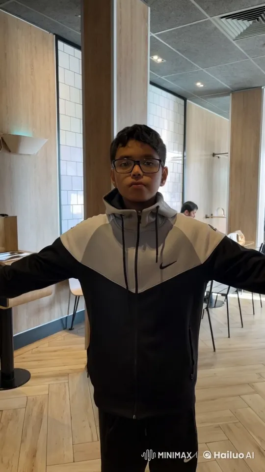 Young Man Smoking in Modern Café Atmosphere – AI Generated Video | Hailuo AI
