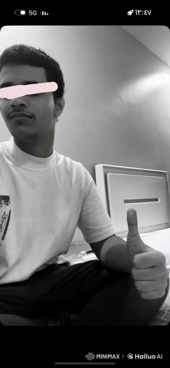 Young Man Smoking with Thumbs-Up in Quiet Room – AI Generated Video | Hailuo AI