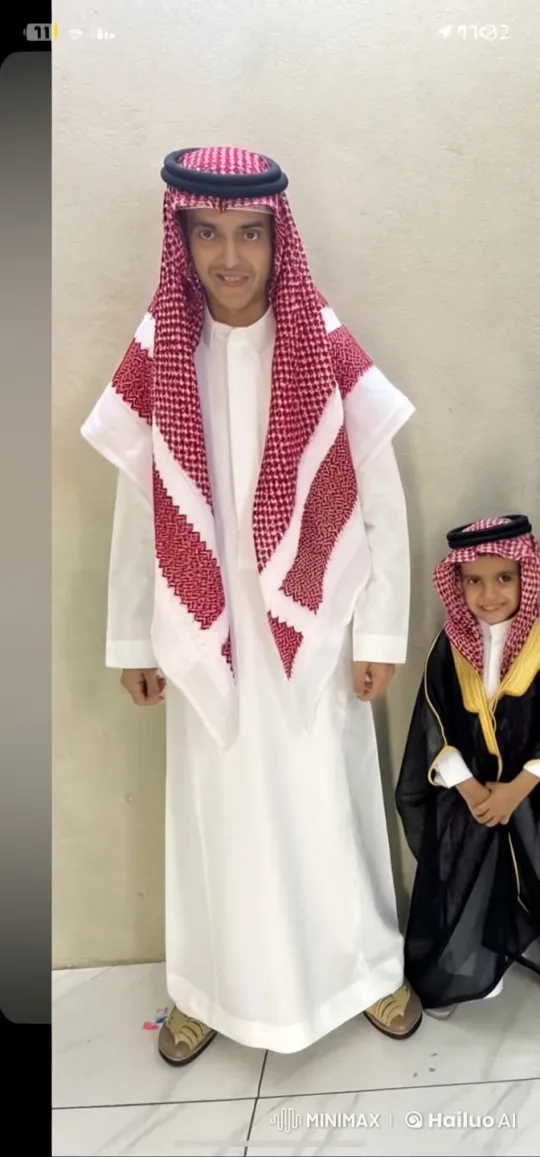 Man in Thobe Smokes, Boy Stands Still – AI Generated Video | Hailuo AI