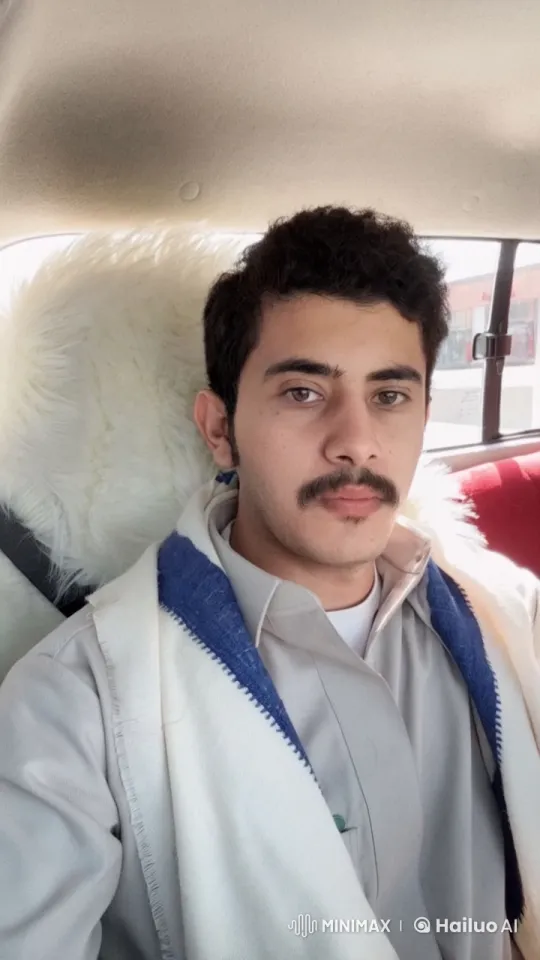 Traditional Attired Person Smokes in Car with Serene Atmosphere – AI Generated Video | Hailuo AI