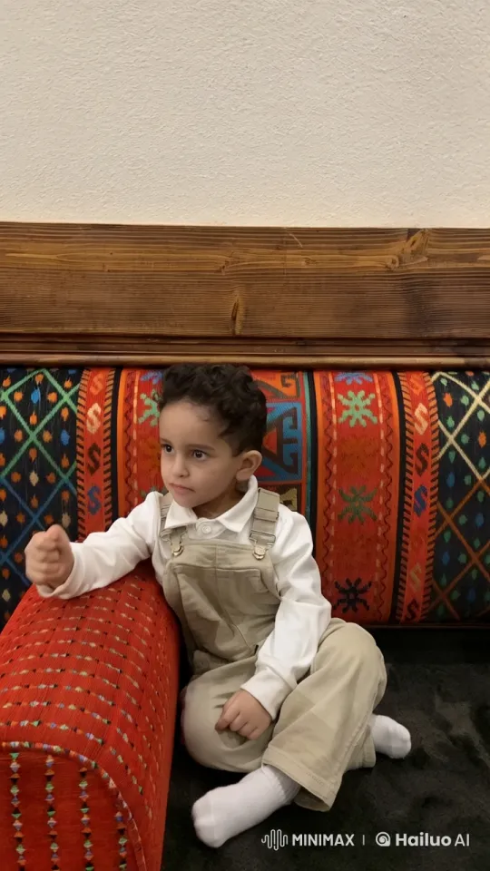 Child Mimics Smoking on Vibrant Couch – AI Generated Video | Hailuo AI