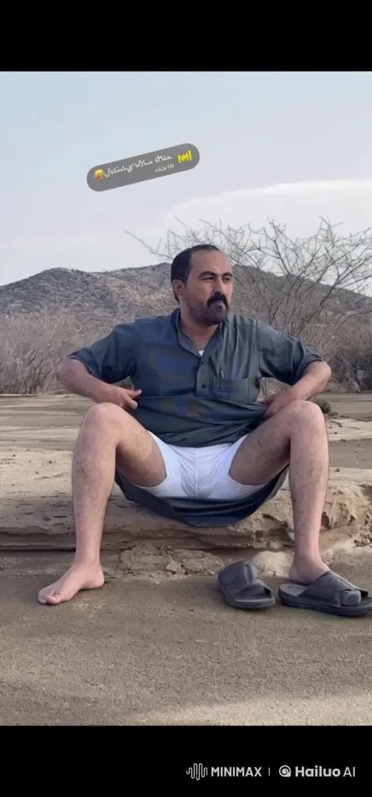 Man Relaxing on Rocky Outcrop, Smoking – AI Generated Video | Hailuo AI