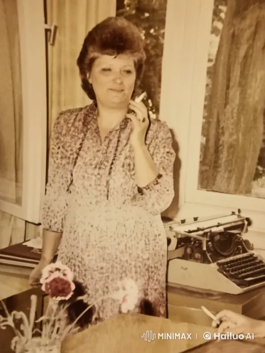 Woman with Typewriter and Flowers in Nostalgic Scene – AI Generated Video | Hailuo AI