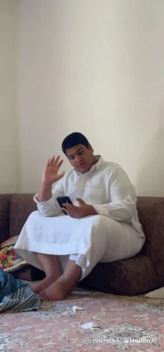 Traditional Dress, Smartphone, and Smoking in a Quiet Room – AI Generated Video | Hailuo AI