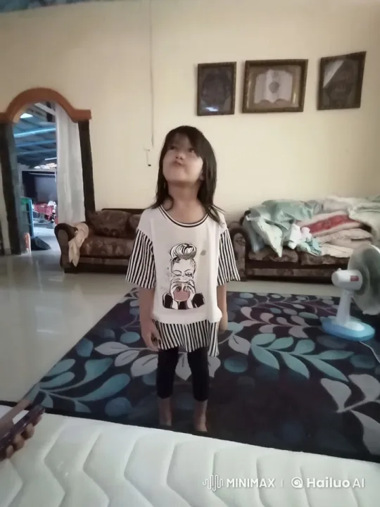 Young Girl Joyfully Waves Palestinian Flag in Cozy Home – AI Generated Video | Hailuo AI