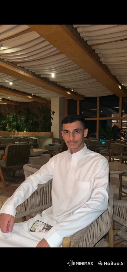 Man Smokes in Cozy, Lush Restaurant Setting – AI Generated Video | Hailuo AI