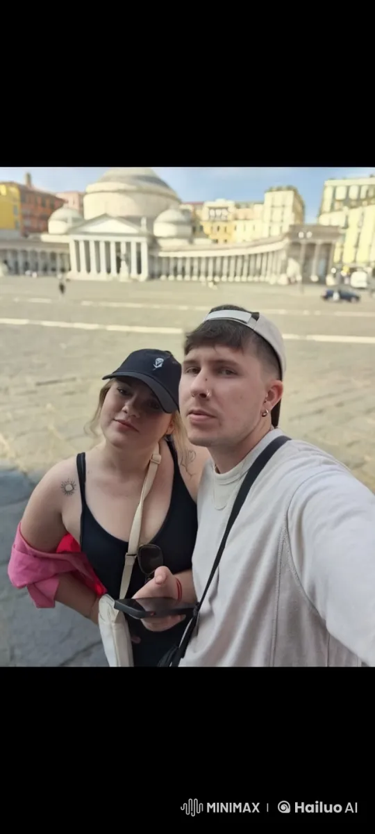 Young Couple Shares Affectionate Moment in Historic Square – AI Generated Video | Hailuo AI