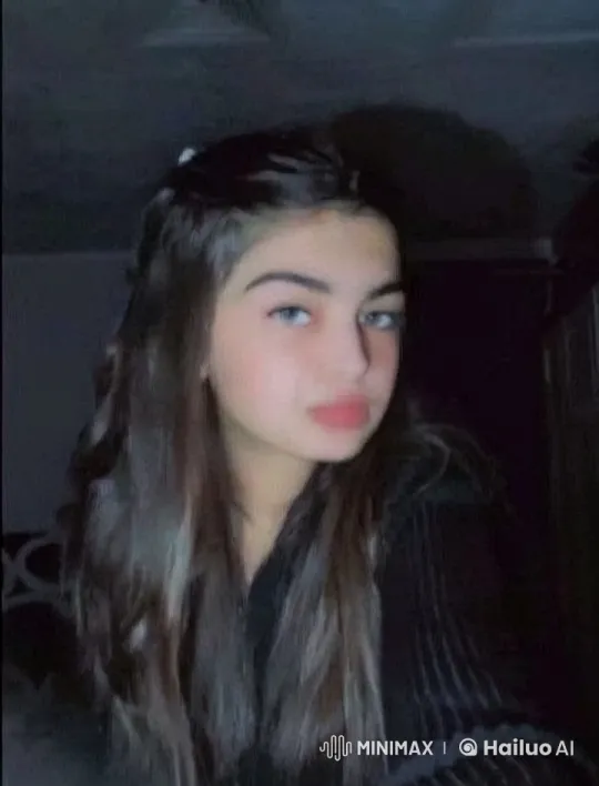 Young Woman Smoking Meditatively in Dim Light – AI Generated Video | Hailuo AI