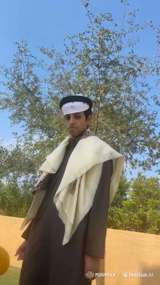 Traditional Attire Person Smoking Outdoors Amidst Nature – AI Generated Video | Hailuo AI